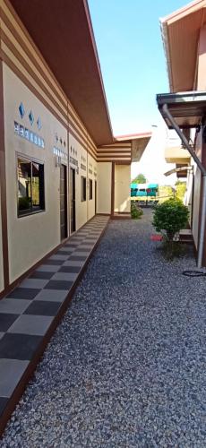 a building with a checkered floor in front of it at Touch the Wind in Chaiyaphum