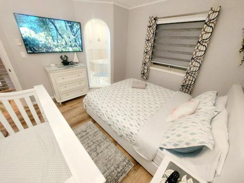 a small bedroom with a bed and a window at Paradise in heart of Poconos FaSt InTeRnEt Close to All Attractions in Pocono Summit