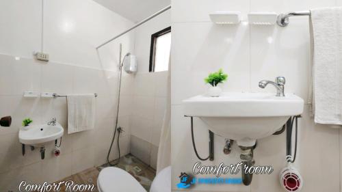 a white bathroom with a sink and a toilet at Ormoc Mountain View House in Ormoc