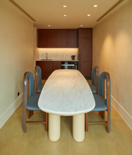a dining room with a table and chairs at The Standard, Bangkok Mahanakhon in Bangkok