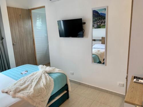 Uma cama ou camas num quarto em Ritacuba House Boutique