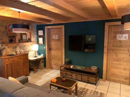 a living room with a couch and a table at Apartment in Morzine - Ski In - Sleeps 6 in Morzine