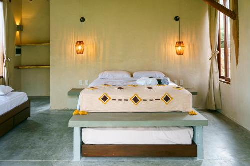 a bedroom with a large bed in a room at Casa Mambo Salinas in Santa Veronica