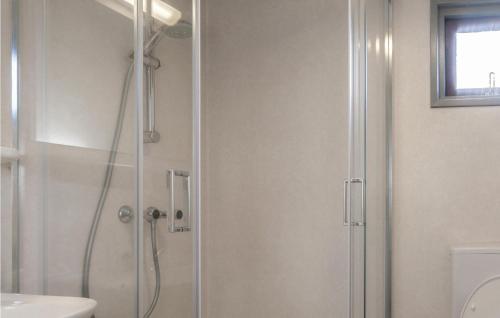 a shower with a glass door in a bathroom at Awesome Home In Well With Kitchen in Well