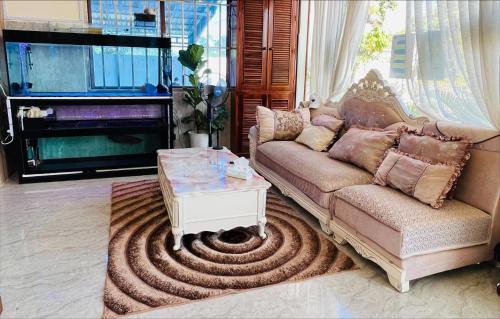 a living room with a couch and a coffee table at Thyda koh kong in Koh Kong