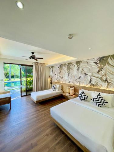 Giường trong phòng chung tại Isla Amara Resort