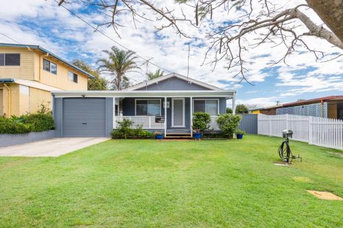 a house with a lawn in front of it at Ray Bon in Iluka