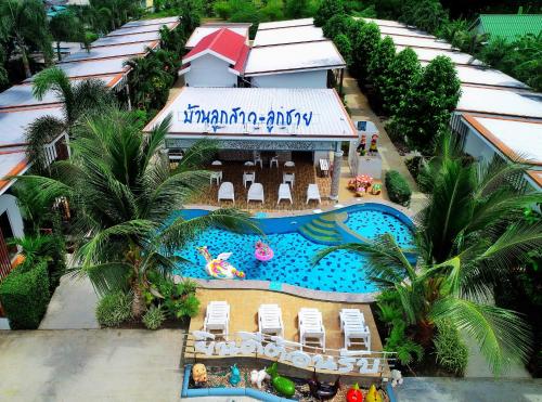 an aerial view of a resort with a swimming pool at Baanloksouylokchay in Hua Hin