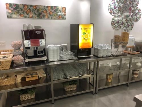 a counter with a coffee maker on top of it at Albergue Inturjoven Cazorla in Cazorla