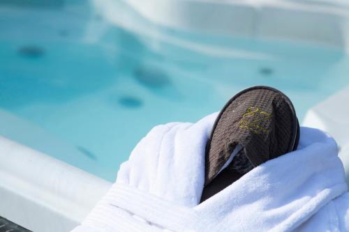 a person wearing a pair of shoes in the snow at Hotel 87 eighty-seven - Maison d'Art Collection in Rome