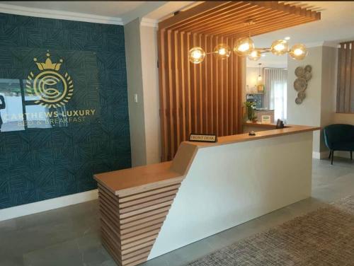 a salon with a reception desk in a room at Carthews Luxury BnB in Queenstown