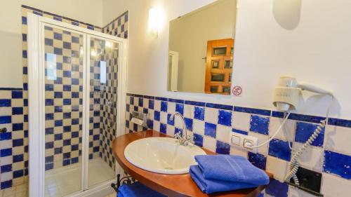 a bathroom with a sink and a mirror at Casa Grande Constantina by Ruralidays in Constantina