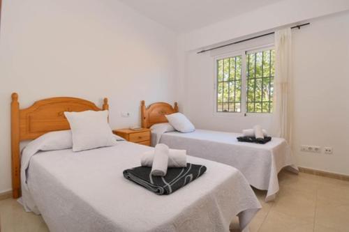 Bonito Apartamento en la Playa del Arenal de Javea tesisinde bir odada yatak veya yataklar