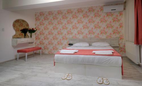 Postel nebo postele na pokoji v ubytování Hotel Abro Sezenler