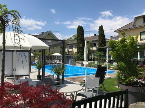 a view of the pool at a villa at Ferienanlage Seehof in Krumpendorf am Wörthersee