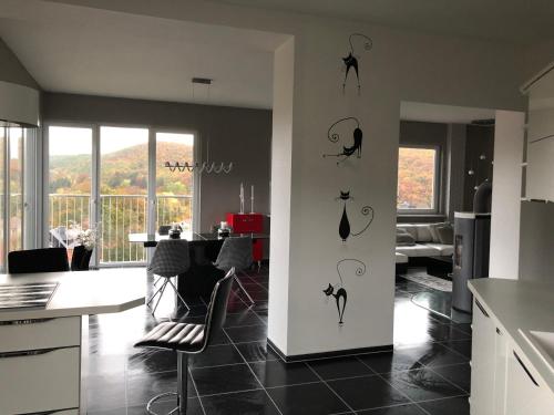 a kitchen with black birds on the wall at Haus Brockenblick in Wernigerode
