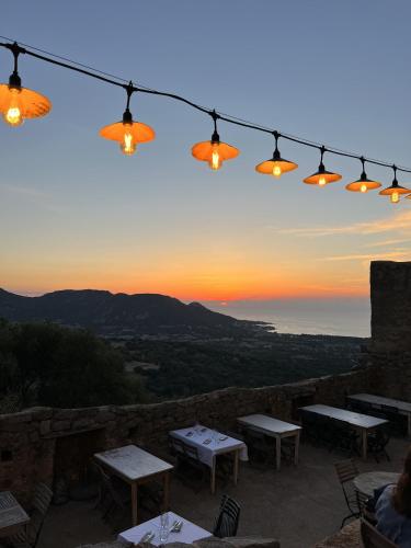 a group of lights on top of a patio with tables at Casa Musicale in Pigna