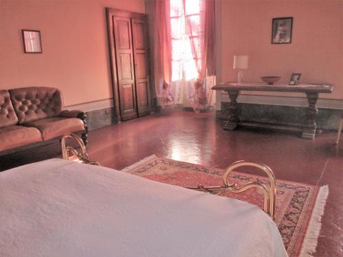 a living room with a couch and a table at Villa Cantoni in Gropello Cairoli