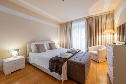 Postel nebo postele na pokoji v ubytování Milan Duomo Suites