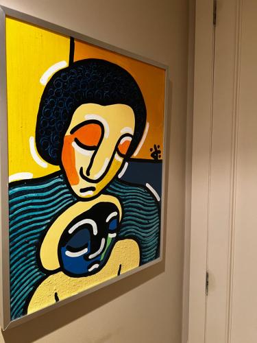 a painting hanging on a wall in a room at RESIDENCIAL MONDARIZ BALNEARIO 118 in Mondariz-Balneario