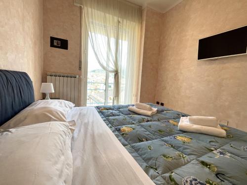 En eller flere senge i et værelse på Appartamenti Levantomare