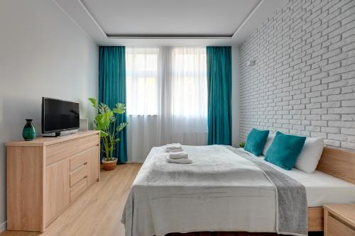 Posteľ alebo postele v izbe v ubytovaní Comfort Apartments Grobla II