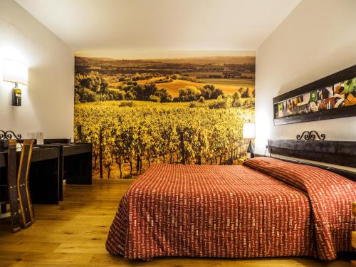 a bedroom with a bed and a painting of a vineyard at Hotel Giò Wine e Jazz Area in Perugia