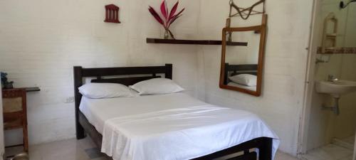 Postel nebo postele na pokoji v ubytování Hostel Finca La Gordita