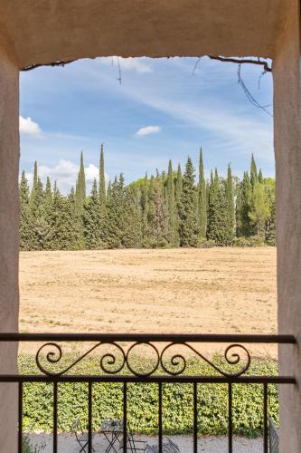 a view of a field from a window at Domaine Gaogaia in Aix-en-Provence