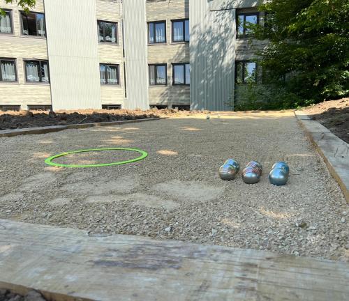 two ping pong balls on the ground in front of a building at Logis Hôtel Des Acacias Lille Neuville en Ferrain, Restaurant l'Acacias Gourmand in Neuville-en-Ferrain