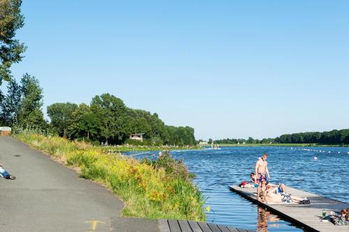 a group of people on a dock in the water at Hotel zum Kuhhirten in Bremen
