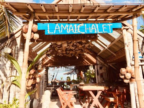 a restaurant with a sign that reads lanai habitat at Lamai chalet in Amphoe Koh Samui