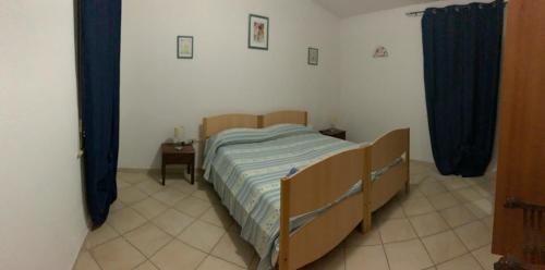 A bed or beds in a room at Casa vacanze Barvis