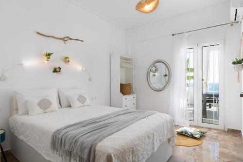 Ένα ή περισσότερα κρεβάτια σε δωμάτιο στο Blue Paradise Apartment