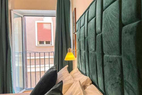 Posteľ alebo postele v izbe v ubytovaní Studio Flat - Piazza San Cosimato By YourHost