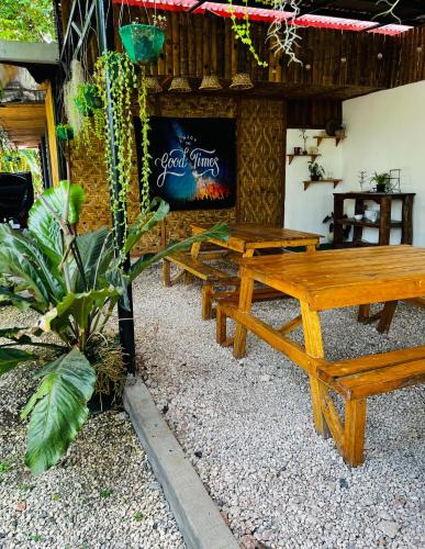 a group of picnic tables in front of a restaurant at Bohol Island Homestay in Dauis