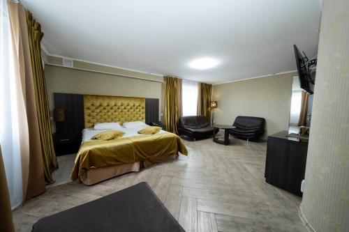 Katil atau katil-katil dalam bilik di Ostrov Hotel