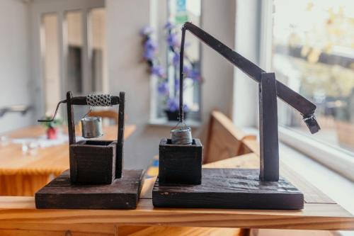 a couple of black objects sitting on top of a table at Apartman Marta i soba Maja in Gradište
