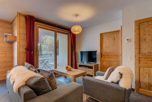 Televízia a/alebo spoločenská miestnosť v ubytovaní Apartment le Paradis 1 - Alpes Travel - Central Chamonix (sleeps 4)