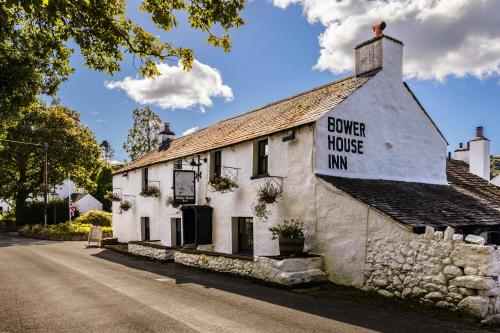 a white building with a sign that reads server house inn at Bower House Inn in Eskdale