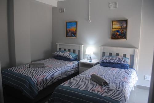 Ένα ή περισσότερα κρεβάτια σε δωμάτιο στο Beachfront Bungalow