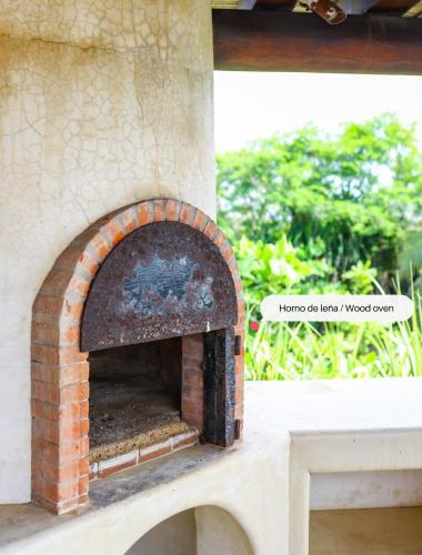a brick oven sitting on top of a table at Beautiful Family House Beachfront in La Unión
