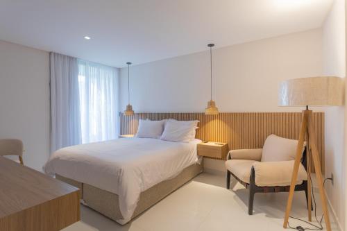Voodi või voodid majutusasutuse Acqua Residences Luxury Collection toas