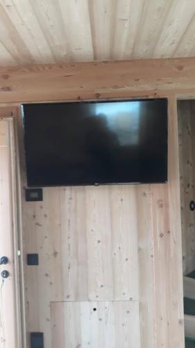 a flat screen tv hanging on a wall at Chalet Silvesterhütte in Seiser Alm 