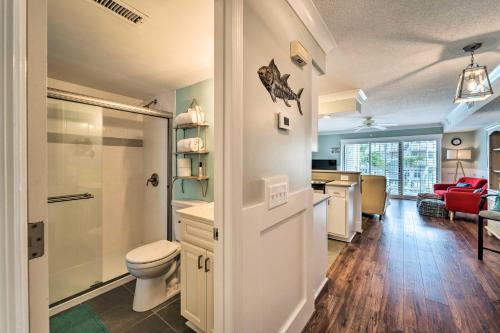 a bathroom with a shower and a toilet and a sink at Bright Carolina Beach Condo - Walk to Shore! in Carolina Beach