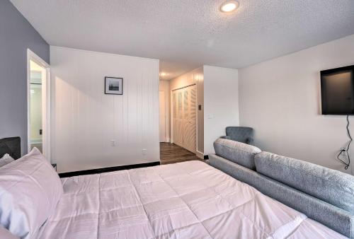 a bedroom with a large bed and a television at Airy Apt Situated in the Coosa River Area! in Gadsden