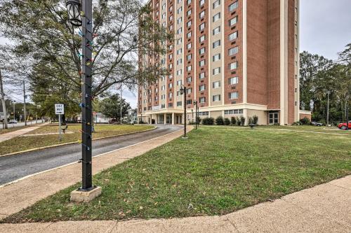 a pole in the grass in front of a building at Airy Apt Situated in the Coosa River Area! in Gadsden