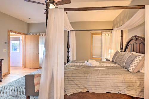 a bedroom with a bed with a canopy at Lakefront Romulus Retreat with Private Dock! in Romulus