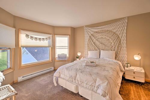 a bedroom with a large bed and a window at Lakefront Romulus Retreat with Private Dock! in Romulus