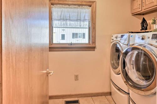 a washing machine in a kitchen with a window at Lakefront Romulus Retreat with Private Dock! in Romulus